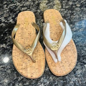New Michael Kors sandals.   Jelly bottom.  Gold size 9. Cork sole